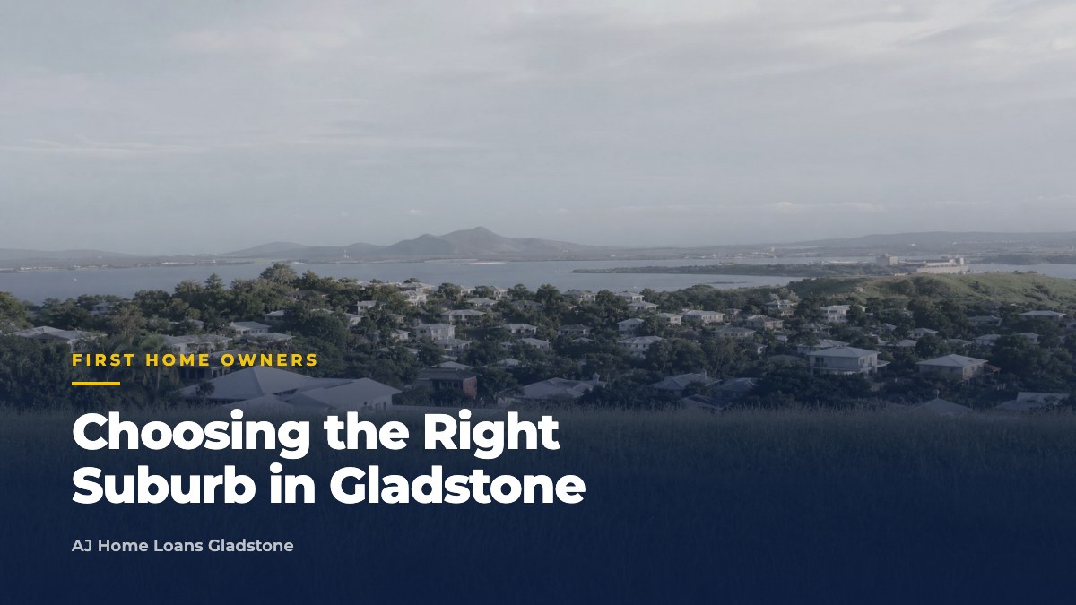 Young couple at a modern kitchen island, intently reviewing a digital map of Gladstone, pointing at suburbs, planning their future.